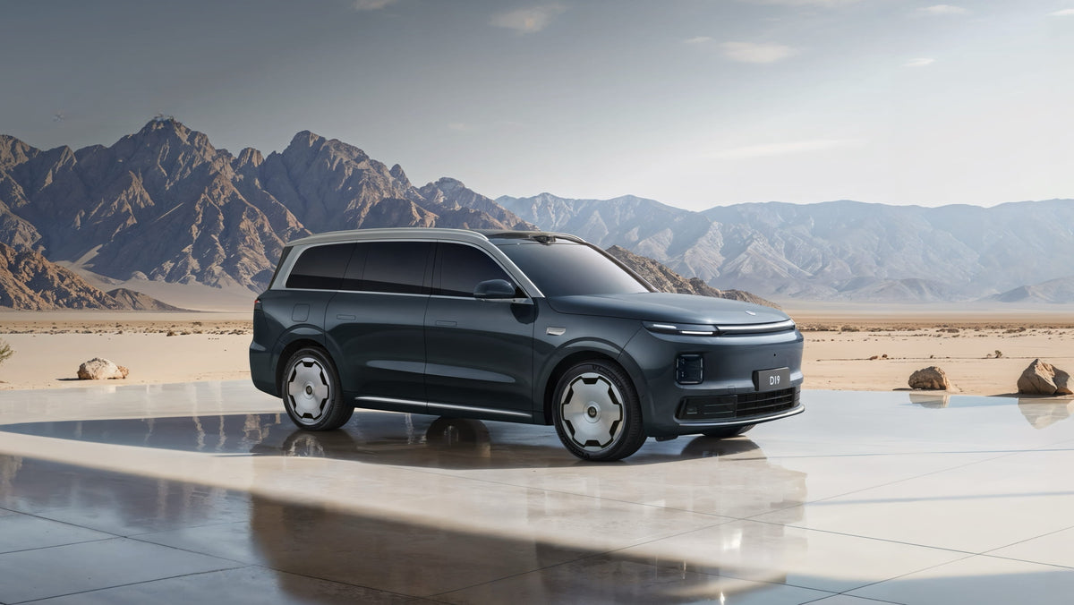 Dark grey Leapmotor C16 electric SUV parked on a reflective platform in a desert landscape.